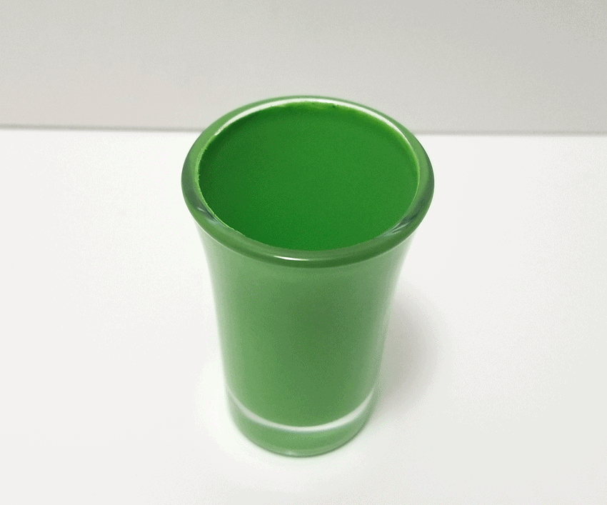 Painting the inside of the shot glass green for a St. Patrick's Day milkshake look.