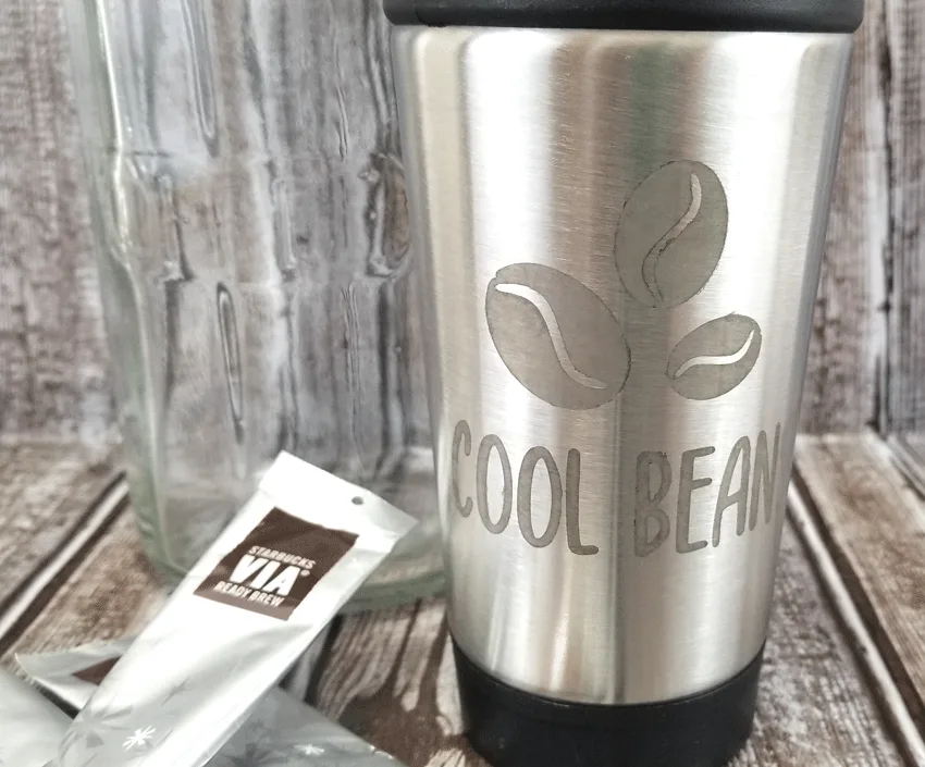 Finished etched metal coffee travel cup from the Dollar Tree.