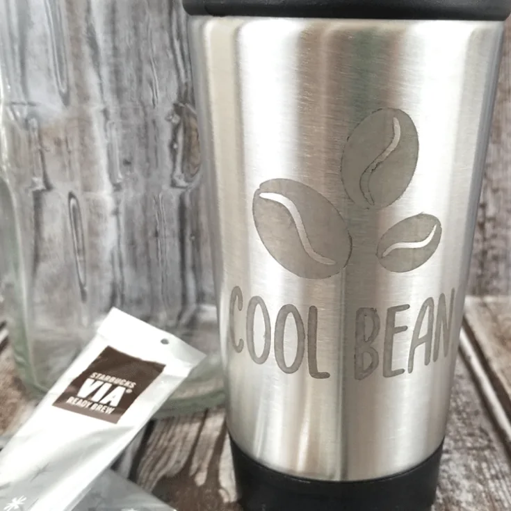 Finished coffee travel mug with etched metal design