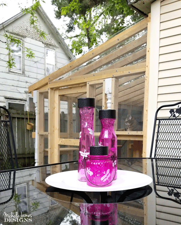 Finished DIY decorative solar lights in a cluster on the patio table.