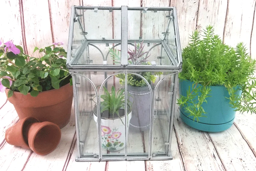 Finished mini greenhouse painted with chalk paint and distressed with sanding block
