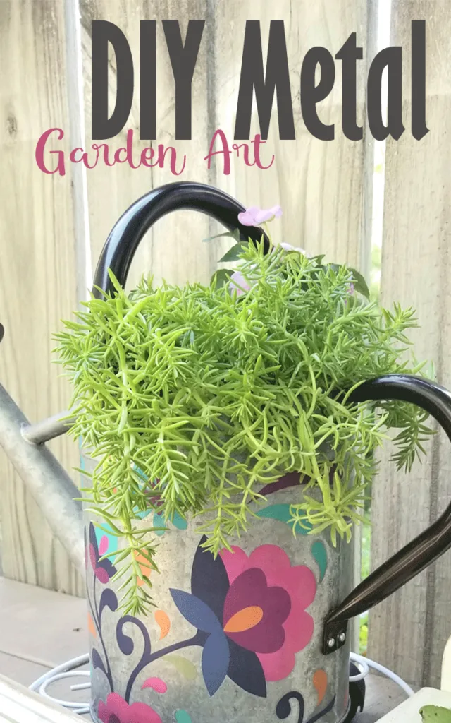 This finished DIY Metal Garden Art watering can was decorated with Dixie Belle transfers.