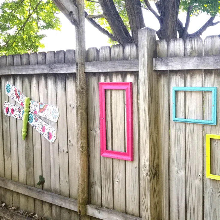 Dixie Belle transfers made this dragonfly fence decor shine with color.