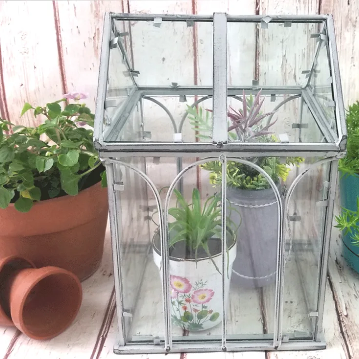 Finished mini greenhouse painted with chalk paint and distressed with sanding block