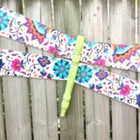 Finished dragonfly hanging on the fence
