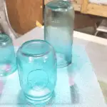 Spray painted glass jars after three coats of paint.