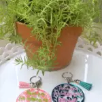 Finished DIY keychains using UV Resin and vinyl
