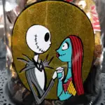 Finished Halloween glass jar. Jack and Sally layered vinyl design.
