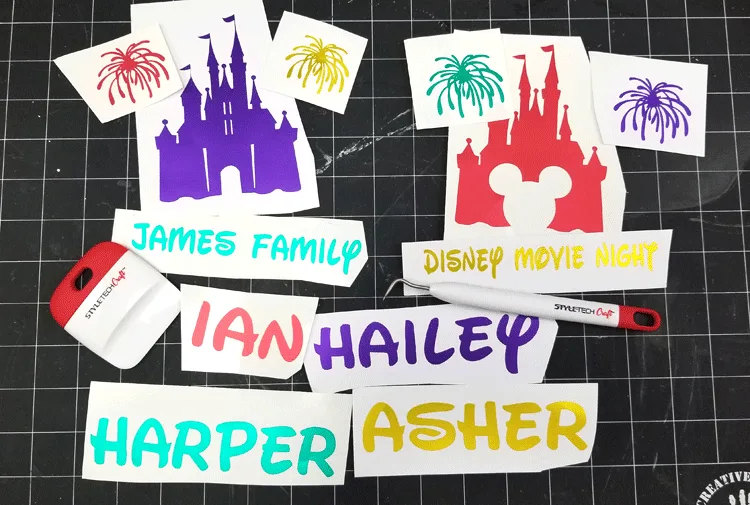 Cut and weeded vinyl pieces of Disney castles and family names