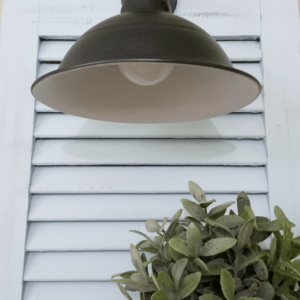 DIY Shutter Sconces - www.michellejdesigns.com - I created my own sconces from plumbing and electrical parts. They are perfect in the shutters...on the wall!