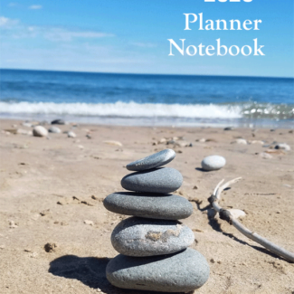 2020 Planner book of stacked rocks on the beach looking toward the water